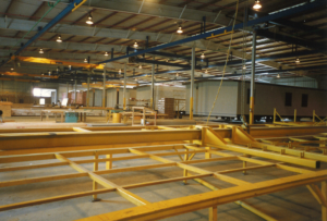 Manufactured home assembly in a factory.