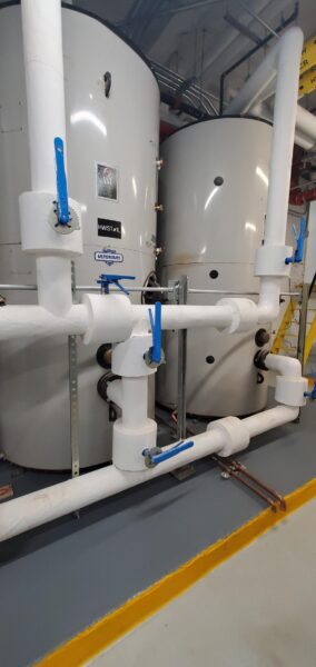 Domestic hot water storage tanks installed as part of Rubin Hall's all-electric retrofit.
