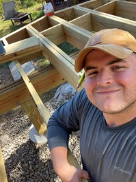 Steven Winter Associates staff member Michael Schmidt building the wood deck of his family home.