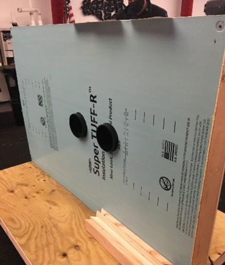 Rear view of a packaged terminal heat pump mock-up used to test air leakage through wall penetrations and equipment connections.