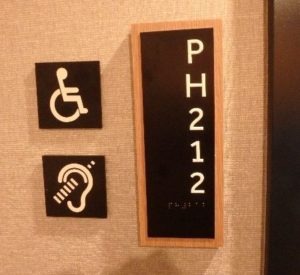 Signage outside of an accessible penthouse hotel room.