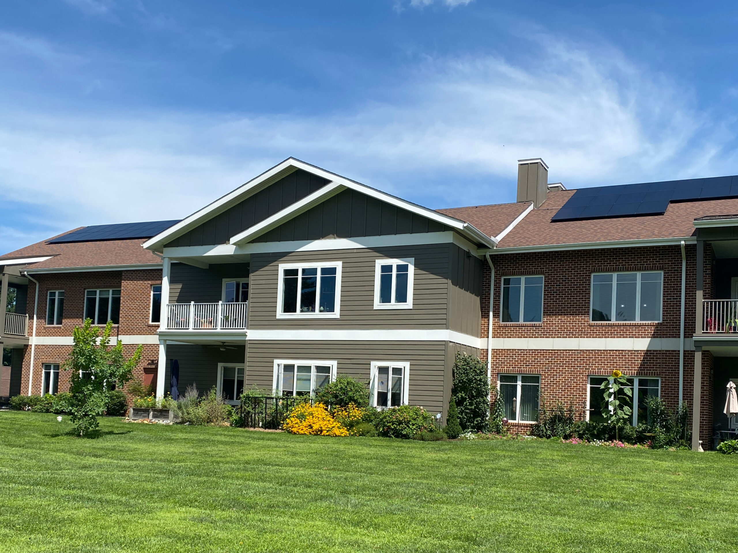 Kendal Crossing multifamily housing community with rooftop solar panels, the site of research evaluating heat pump water heater performance in apartment buildings.