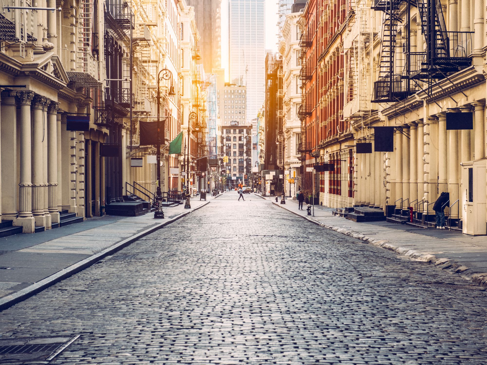 Cobblestone street lined with historic commercial buildings in the SoHo neighborhood of Manhattan, New York City