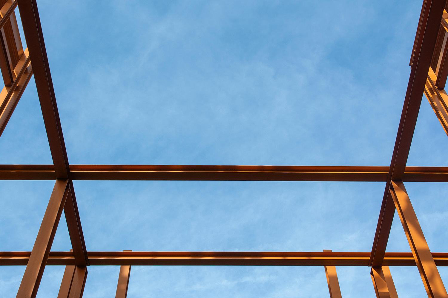 Low angle shot of metal construction under a blue sky