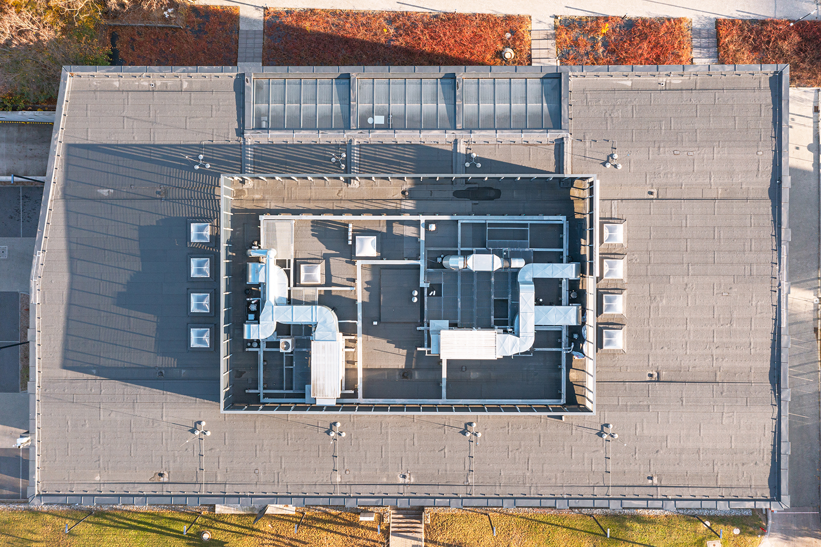 Aerial view of rooftop ventilation ductwork and mechanical equipment on a multifamily building.